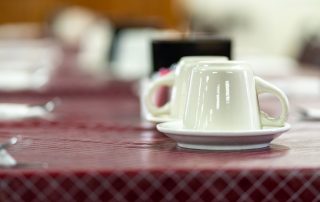 Empty coffee cups await customers at Tiffany's Restaurant in Topeka, Indiana.